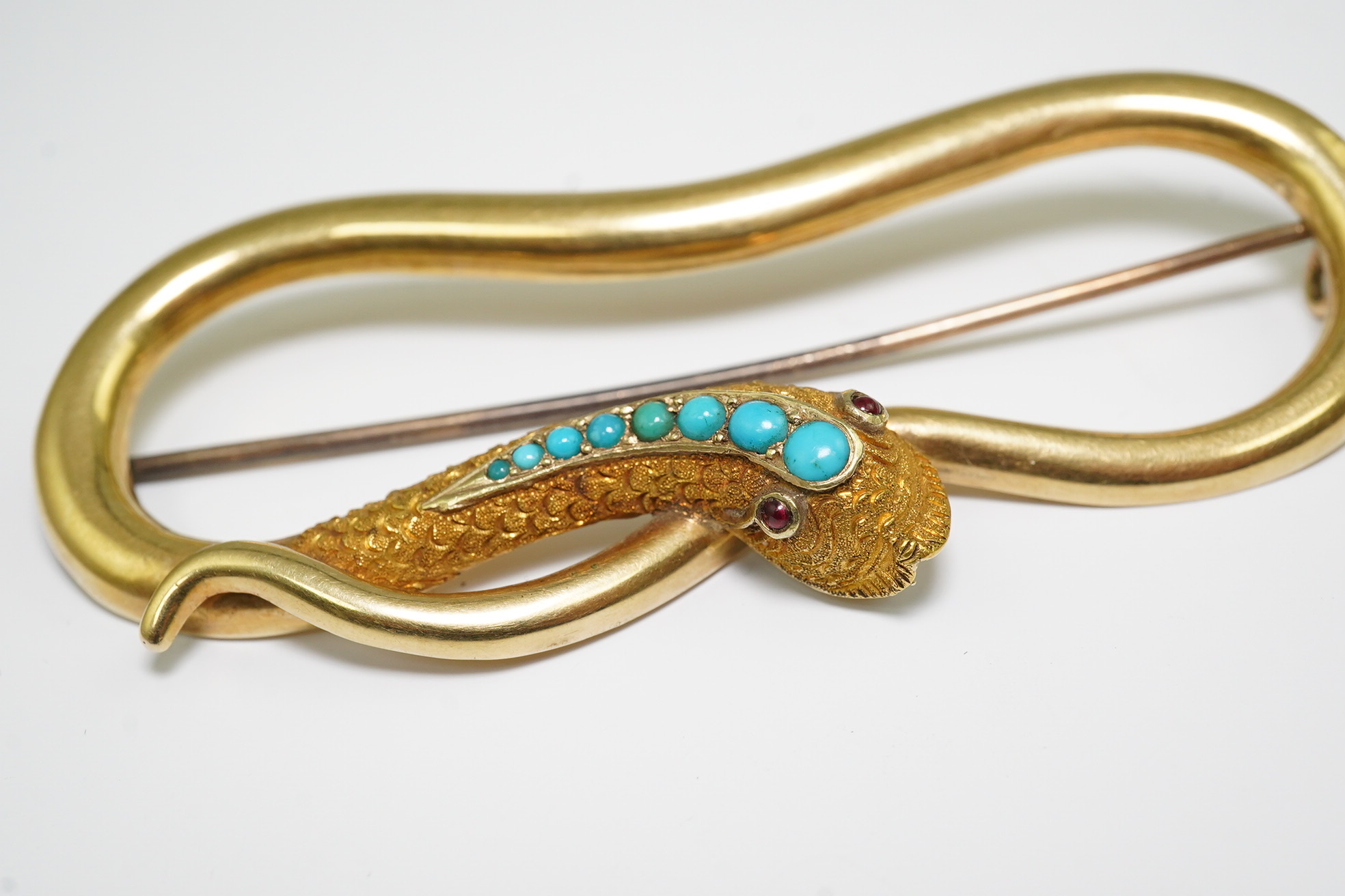 A Victorian gold, turquoise and cabochon gem set open work serpent brooch